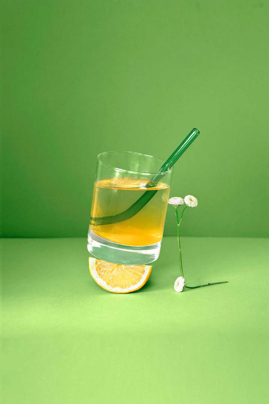 Iced Herbal Tea on Green Background